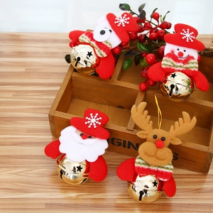 Set of 4 Christmas bells with Santa, snowman, and reindeer figures on dark wood