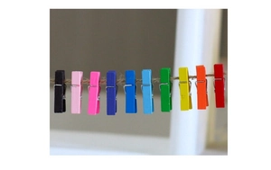 Close-up of 10 colorful wooden mini pegs hanging on a twine rope for photo display