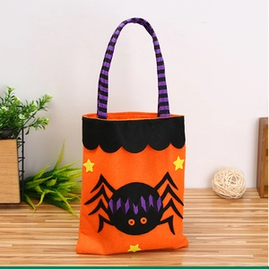 Detail of orange felt Halloween bag featuring a large black spider with purple stripes