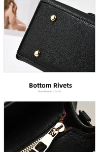 Detail of lychee textured leather tote featuring protective gold bottom rivets and zipper