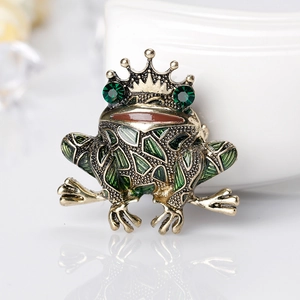 Vintage gold frog king brooch with green rhinestones and enamel crown detail
