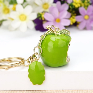 Sparkling green apple keychain with crystals and gold-tone plating for handbags
