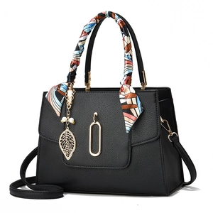 Elegant black lychee leather handbag with printed silk scarf and gold leaf pearl pendant