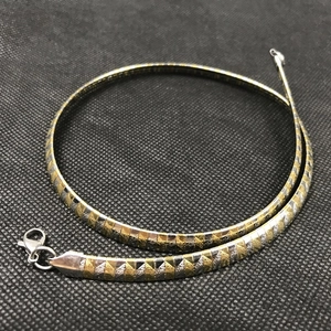 Golden and silver wave pattern stainless steel necklace with lobster clasp closure