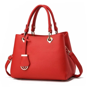 Elegant red litchi texture leather handbag with gold hardware and detachable strap