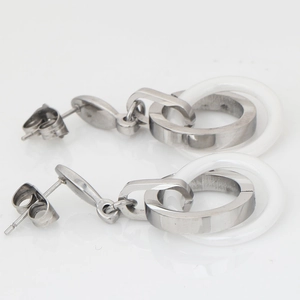 Detail of 16mm stainless steel and white ceramic double ring drop earrings for women