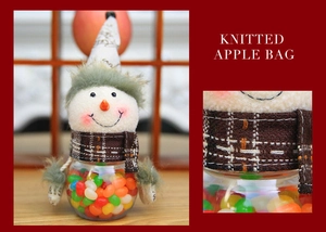 Detail of Christmas snowman candy jar with knitted hat and transparent gift container