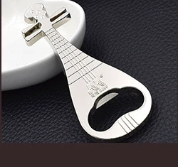 Close-up of silver lute-shaped metal bottle opener keychain with engraved characters