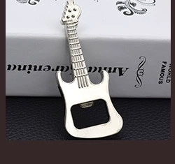 Close-up of a silver metal guitar-shaped bottle opener showing its sleek polished finish