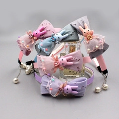 Detailed assortment of infant headbands featuring fabric bows and 3D bunny accents