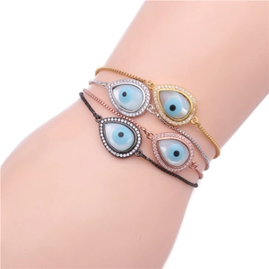Detail showing four evil eye teardrop bracelets in gold, silver, rose gold and gunmetal