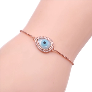 Detail of rose gold evil eye water drop bracelet with cubic zirconia and adjustable clasp