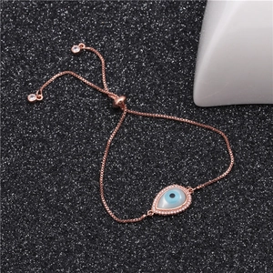 Detail of rose gold evil eye bracelet with cubic zirconia and adjustable slide clasp