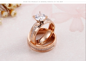 Detail of rose gold hammered rings with prong-set cubic zirconia for women