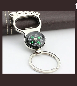 Detail of silver zinc alloy keychain with integrated compass and bottle opener function