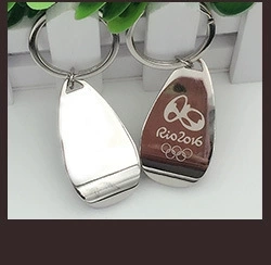 Macro view of silver teardrop metal keychains featuring Rio 2016 engraved logo detail