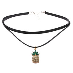 Detail of double-layered black choker featuring a golden pineapple pendant with crystals