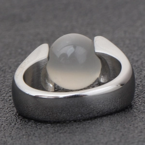 Detail of a 10mm vintage stainless steel ring with a spherical opal stone inlay