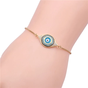 Adjustable evil eye charm bracelet in gold finish with micro-pave blue zircon stones