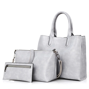 Three-piece light grey oil wax leather handbag set with tote, crossbody bag and pouch