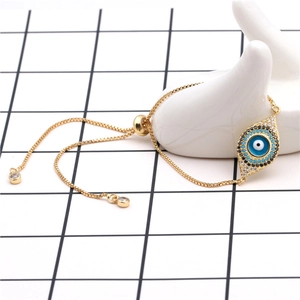 Detailed close-up of adjustable evil eye bracelet with blue zircon and gold plating