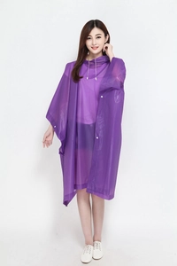 Front view of translucent purple waterproof hooded rain poncho for adults on plain background