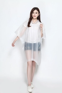 Detailed view of transparent hooded rain poncho with button closure and waterproof material