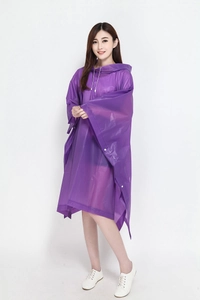 Detail view of purple hooded rain poncho featuring snap buttons and adjustable drawstrings