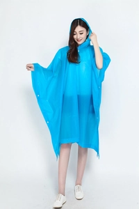 Detail view of the waterproof bright blue hooded rain poncho made of durable material