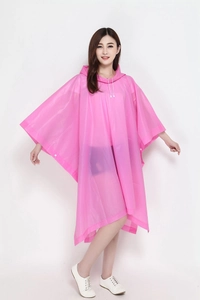 Close-up of pink translucent EVA raincoat with a drawstring hood and snap buttons