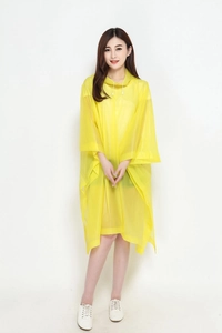 Close-up of translucent yellow hooded rain poncho with lightweight EVA material texture