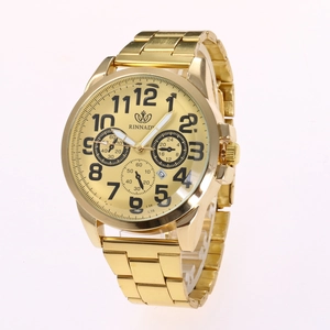 Macro view of golden vintage quartz watch with blue floral pattern and metal chain bracelet