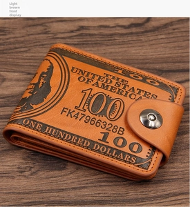 Close-up of light brown vintage men's wallet with dollar print and snap fastener