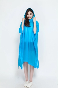 Close-up of blue translucent rain poncho with adjustable hood and side snap buttons