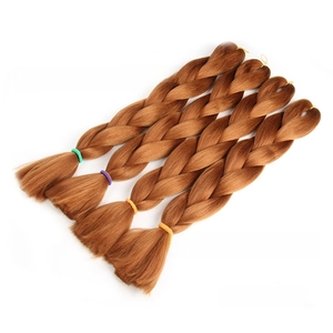 Detailed view of four honey blonde #30 jumbo braid hair bundles with neat fiber texture