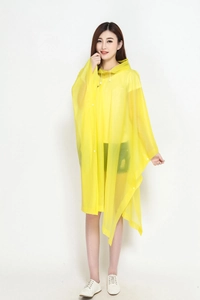 Detail of yellow translucent hooded poncho raincoat featuring drawstring and side snaps