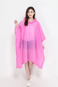Close-up of pink hooded rain poncho showing waterproof EVA material and side snap buttons