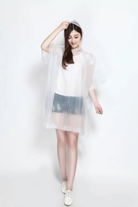 Detail of transparent waterproof hooded raincoat with snap button closure for outdoor use
