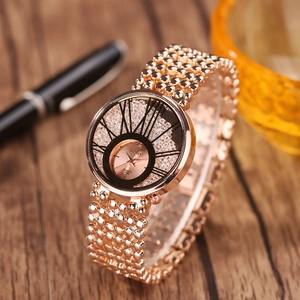 Close-up of rose gold WANYI quartz watch with beaded strap and glittery dial details