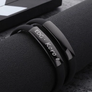 Macro shot of black silicone bracelet featuring engraved stainless steel nameplate EDG Koro 1
