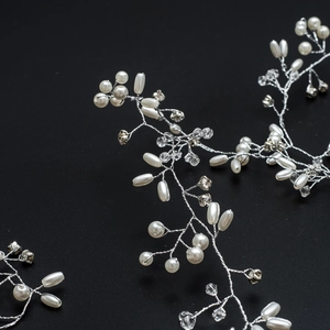 Detailed macro view of 1.5M silver bridal hair vine with pearls and clear crystals