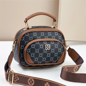 Navy blue clover crossbody bag with dual zippers and adjustable wide strap