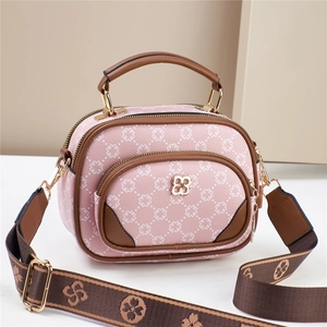 Pink clover-patterned leather crossbody bag for women with brown trim and wide strap