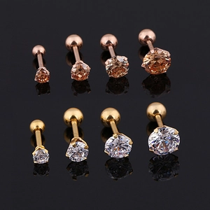 Titanium steel stud earrings with round cubic zirconia in gold and rose gold finishes