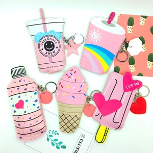 Detail view of five cute pink popsicle and drink shaped mini coin purses with keyrings