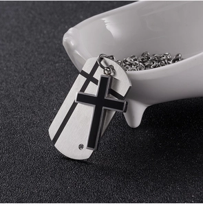 Detail of titanium steel double-layer necklace with black cross and silver dog tag