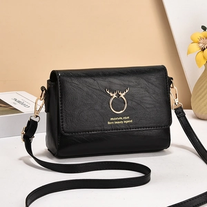 Stylish black pebble leather crossbody bag for women with golden deer horn buckle