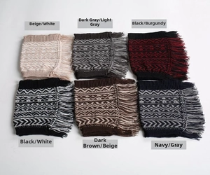 Detail view of various bohemian knit leg warmers with tassels and geometric patterns