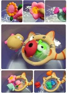 Close-up of children's bath toy set with cat fishing net and colorful water squirting toys