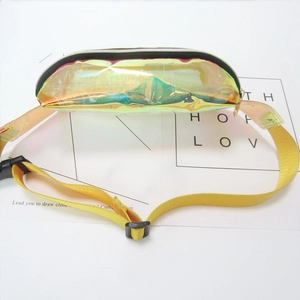 Close-up of holographic laser PVC waist bag with yellow nylon strap and black zipper